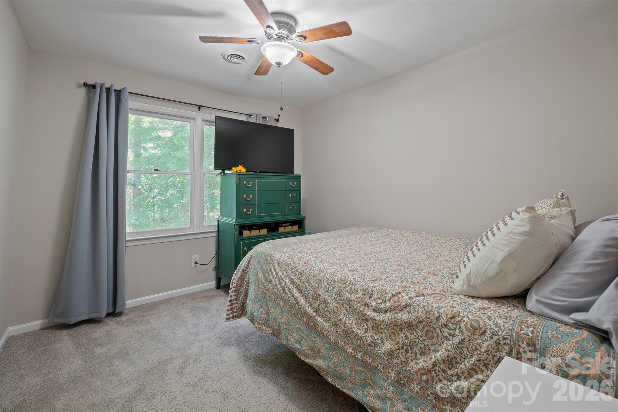 19017 Kailua Circle Tega Cay, SC 29708 - Photo 27 of 46 a bedroom with a bed and a window