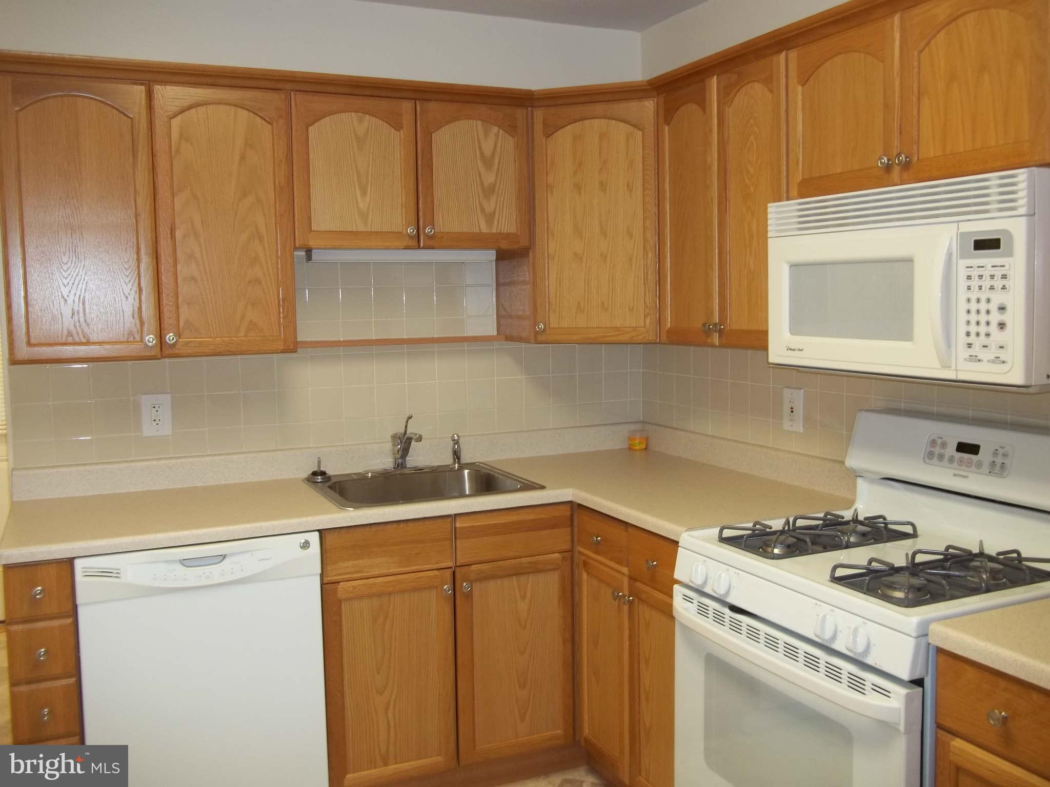 30 Crafton Road Baltimore, MD 21221 - Photo 14 of 17 a view of a kitchen with sink and cabinets