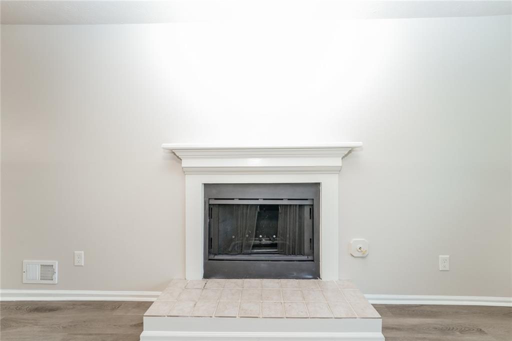 884 3rd Street Stone Mountain, GA 30083 - Photo 18 of 26 a living room with a fireplace