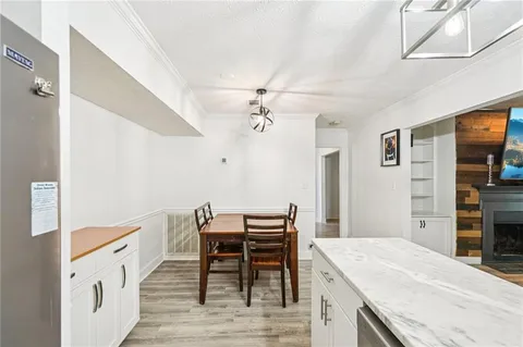 a dining room with a table and chairs