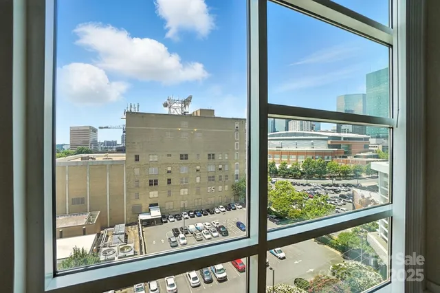 a view of a glass door of the building from a window