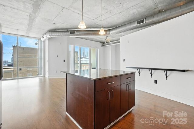 a view of a kitchen with a sink and a window