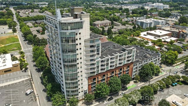 an aerial view of building with trees