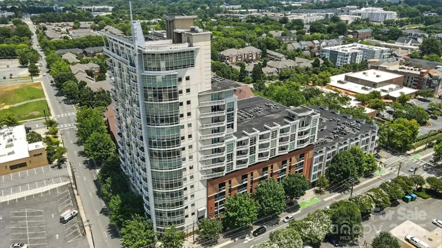 an aerial view of building with trees