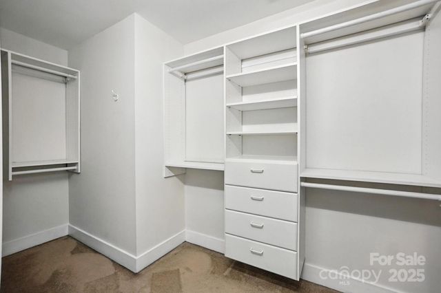 a view of an empty walk in closet