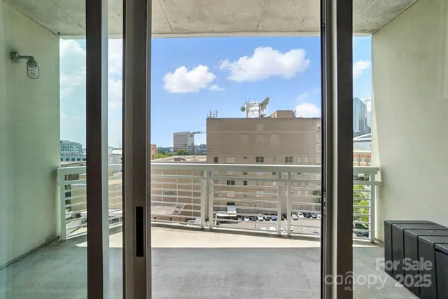 a view of a balcony with city view