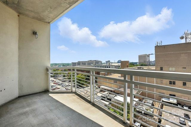 a view of a balcony with city view