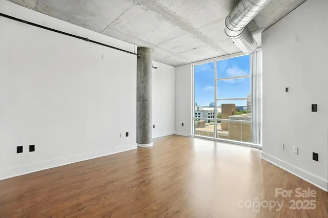 a view of a kitchen with a sink and a refrigerator