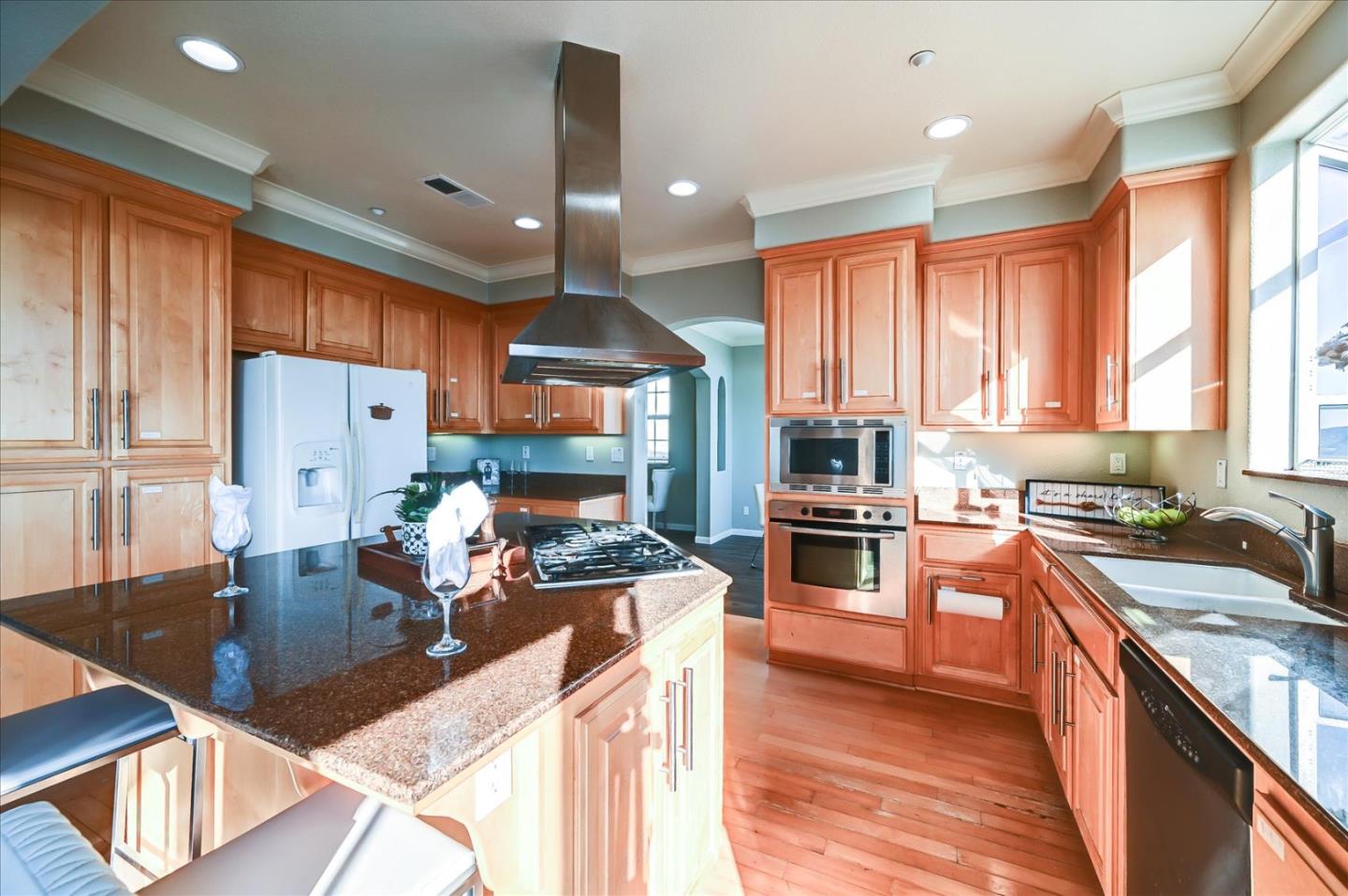 208 Goodwin Drive San Bruno, CA 94066 - Photo 17 of 45 a kitchen with stainless steel appliances granite countertop a stove refrigerator sink and cabinets