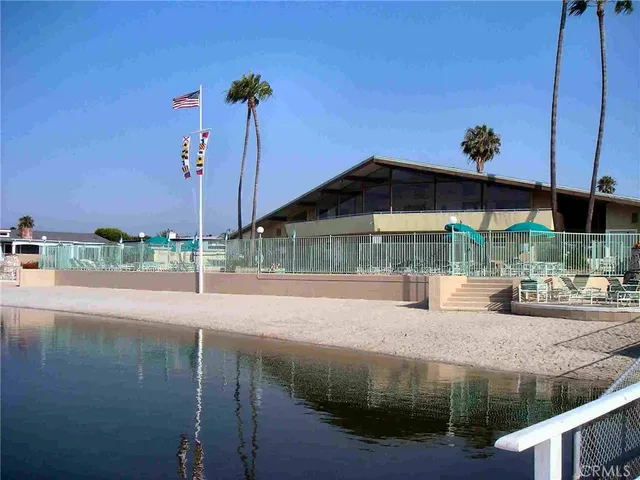 a small pool with a table and chairs