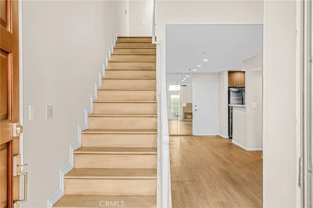 a view of an entryway with wooden floor