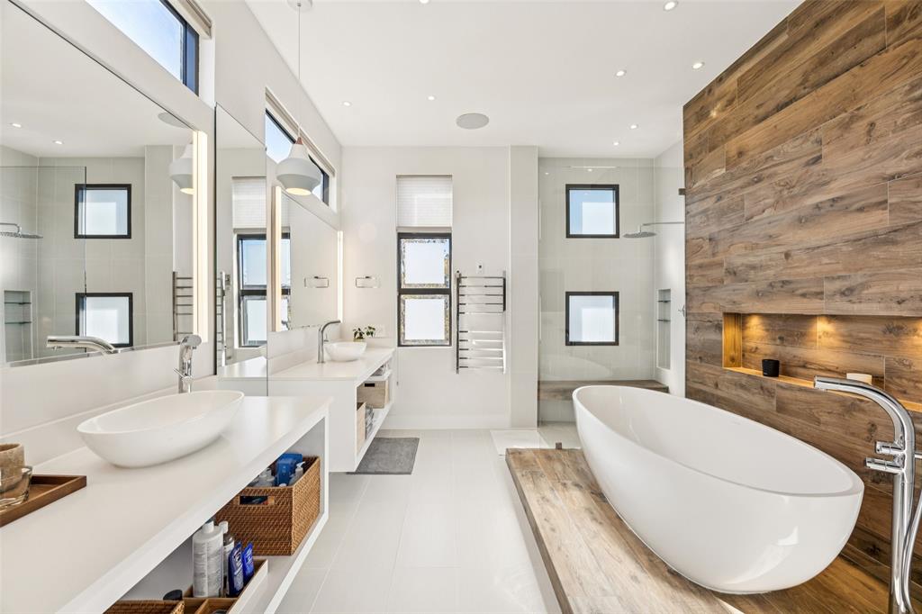 4420 Holland Avenue, Unit A Dallas, TX 75219 - Photo 15 of 32 a living room with furniture a fireplace and a flat screen tv