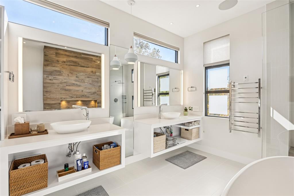 4420 Holland Avenue, Unit A Dallas, TX 75219 - Photo 16 of 32 Another angle of the primary bath highlights abundant counter space and beautiful natural light.