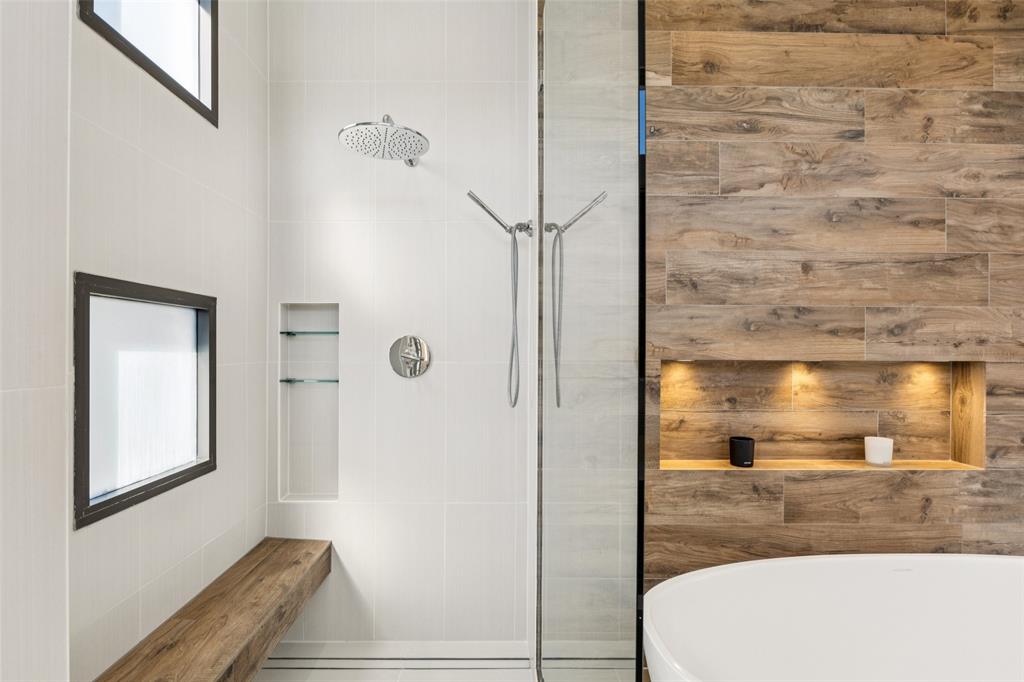 4420 Holland Avenue, Unit A Dallas, TX 75219 - Photo 18 of 32 Large dual shower with built-in bench and rainfall fixture creates a daily dose of luxury.