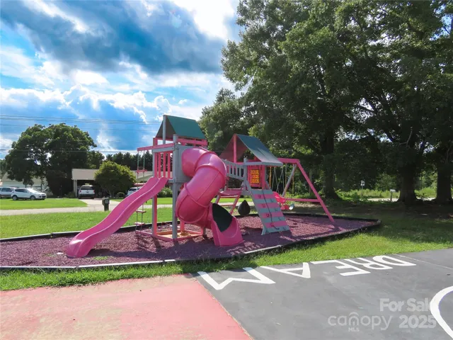 a view of a park with iron fence