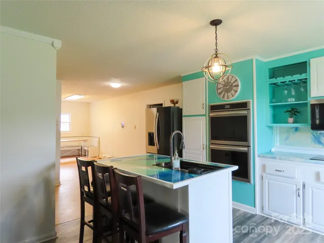 a kitchen with a table and chairs
