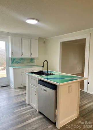 a view of kitchen and wooden floor