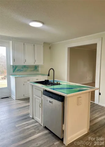 a view of kitchen and wooden floor