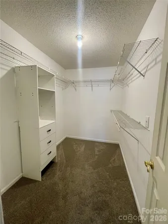 a view of a room with racks on the wall