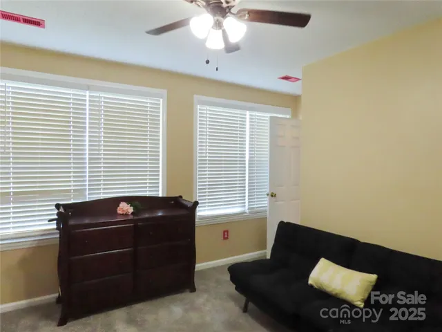 a living room with a couch and a flat screen tv