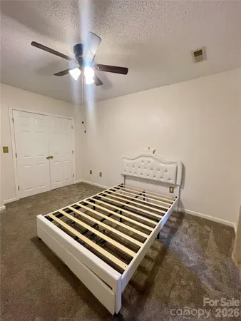 an empty room with a empty space and windows