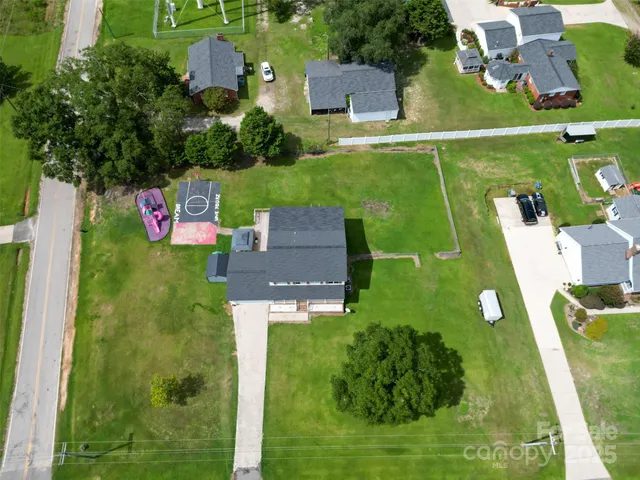 an aerial view of a house with a garden