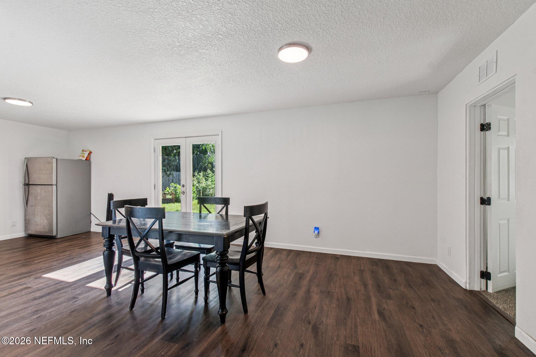 1417 Clock Street Jacksonville, FL 32211 - Photo 11 of 39 a view of a dining room with furniture and wooden floor