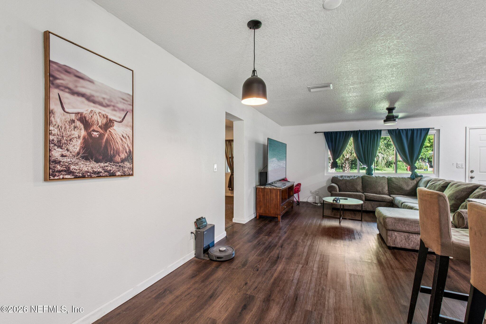 1417 Clock Street Jacksonville, FL 32211 - Photo 14 of 39 a living room with furniture and a wooden floor