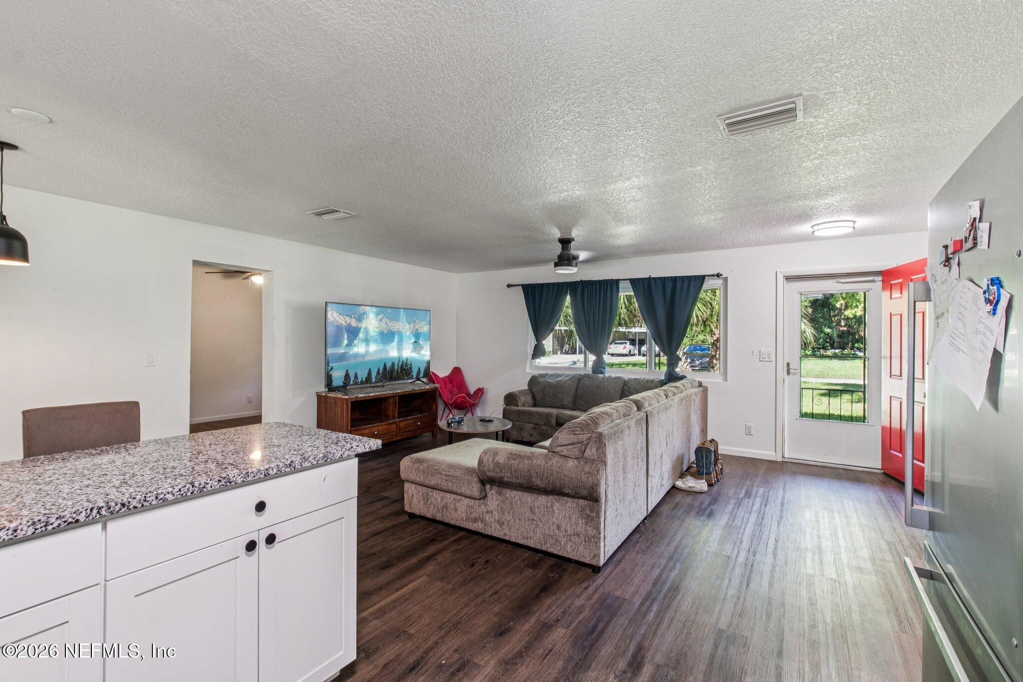 1417 Clock Street Jacksonville, FL 32211 - Photo 19 of 39 a living room with furniture and a flat screen tv