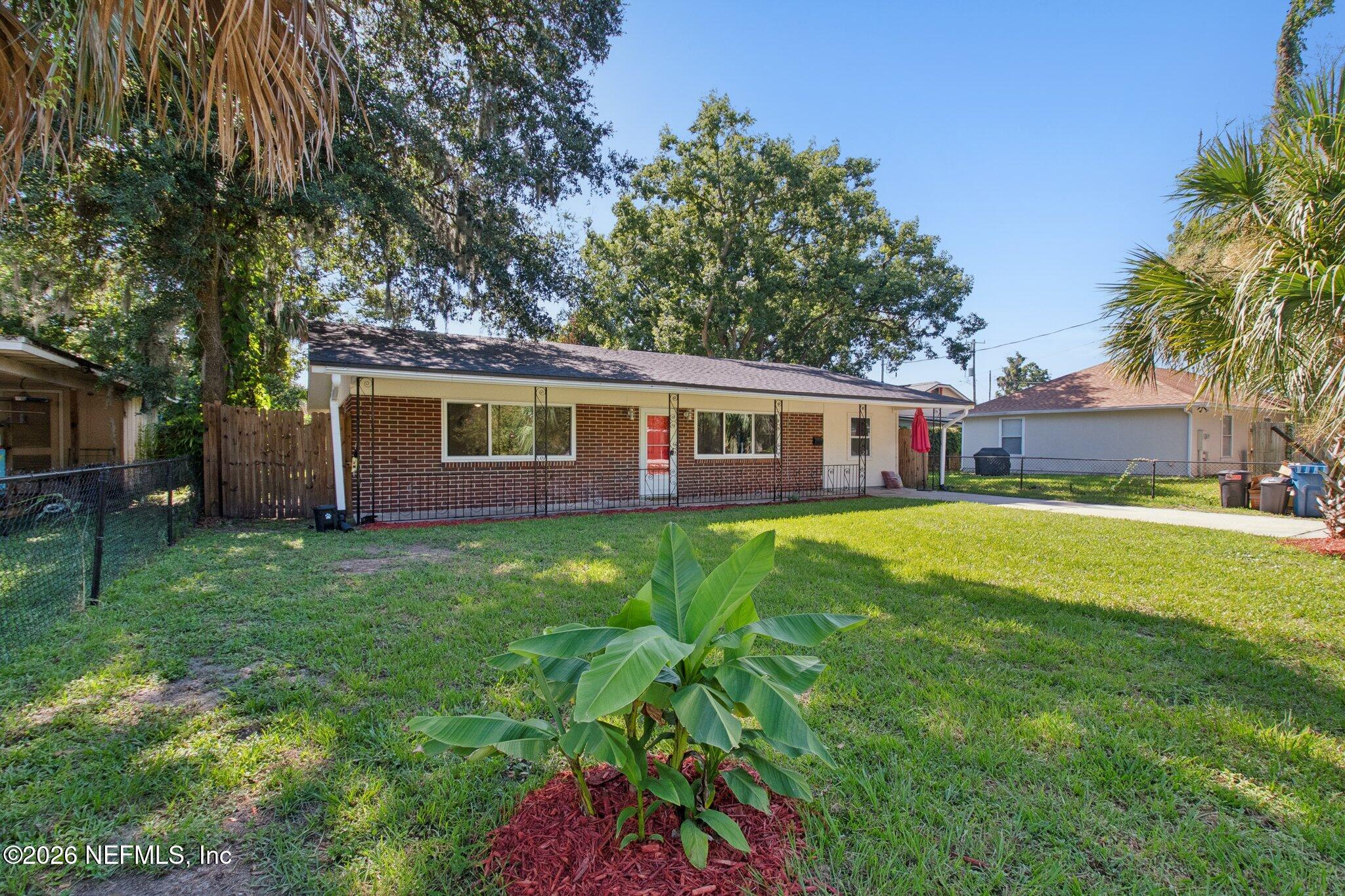 1417 Clock Street Jacksonville, FL 32211 - Photo 2 of 39 a front view of house with yard and green space