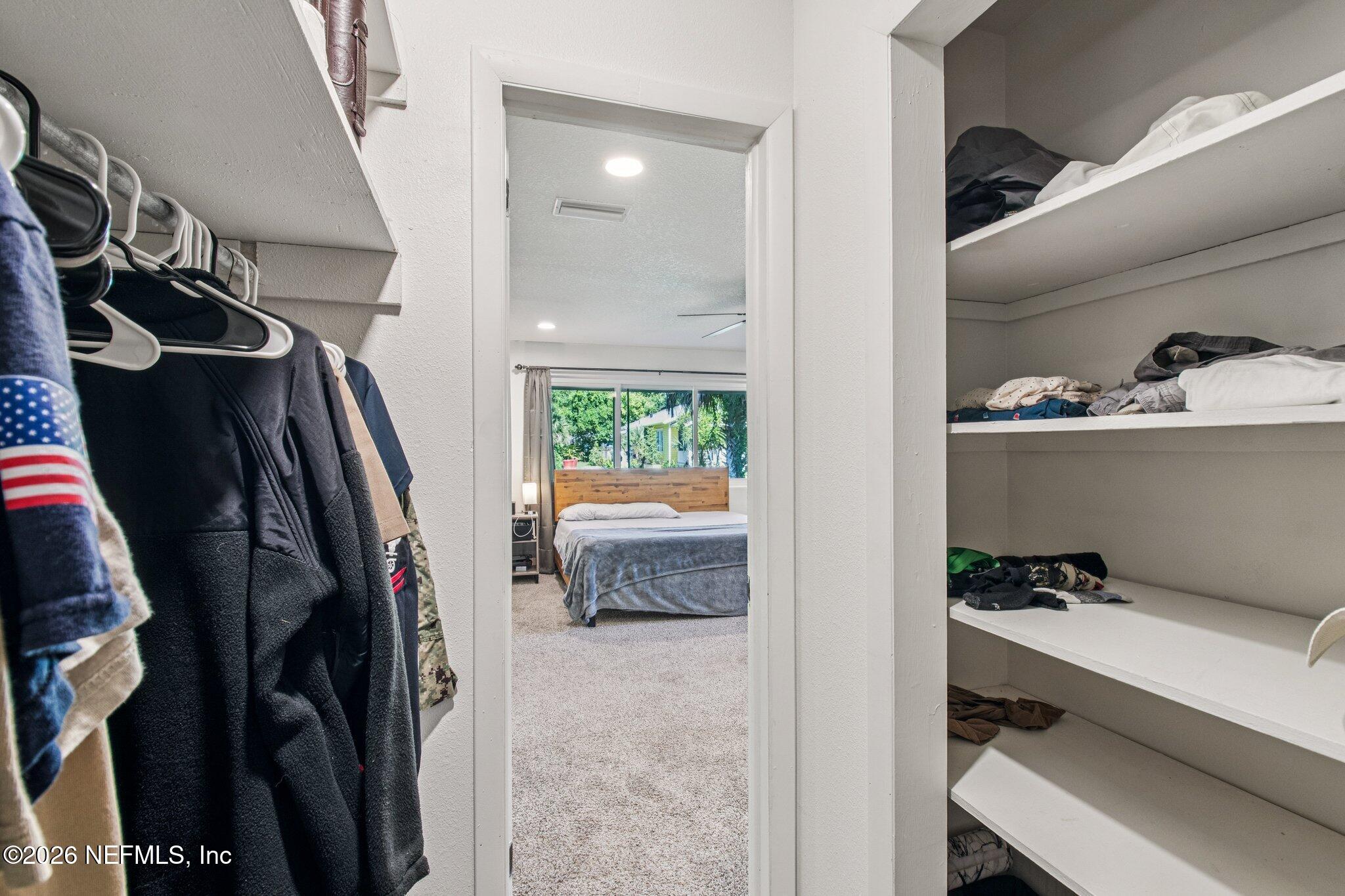 1417 Clock Street Jacksonville, FL 32211 - Photo 24 of 39 a view of walk in closet with clothes and shoes
