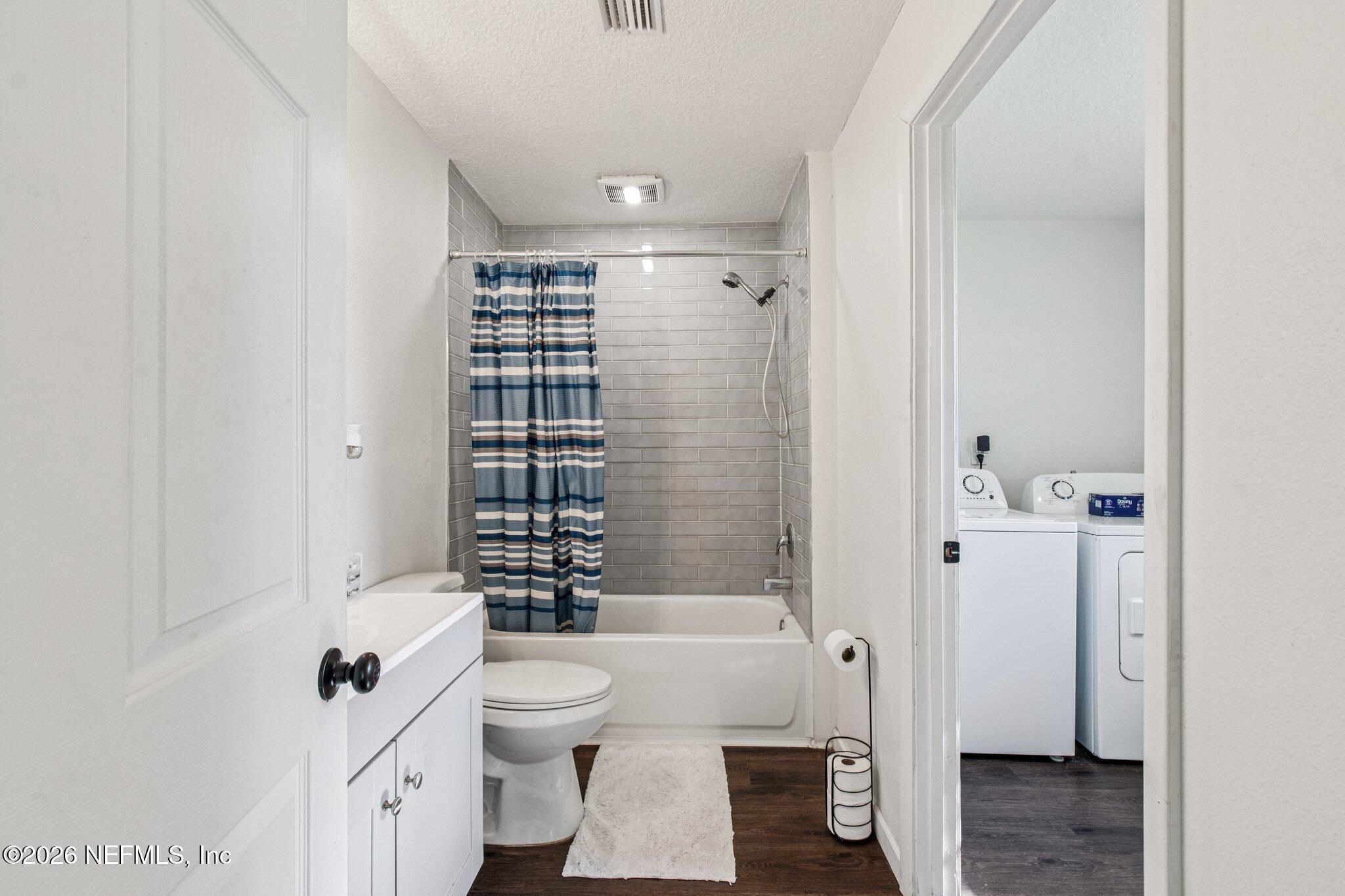 1417 Clock Street Jacksonville, FL 32211 - Photo 33 of 39 a bathroom with a sink toilet and shower