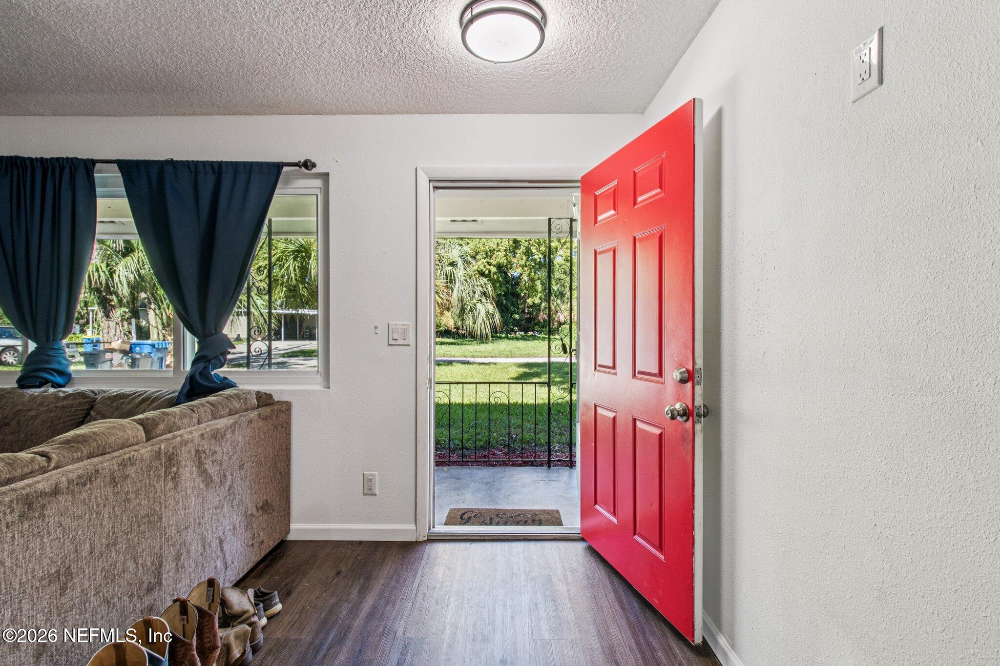 1417 Clock Street Jacksonville, FL 32211 - Photo 5 of 39 a living room with furniture and a flat screen tv