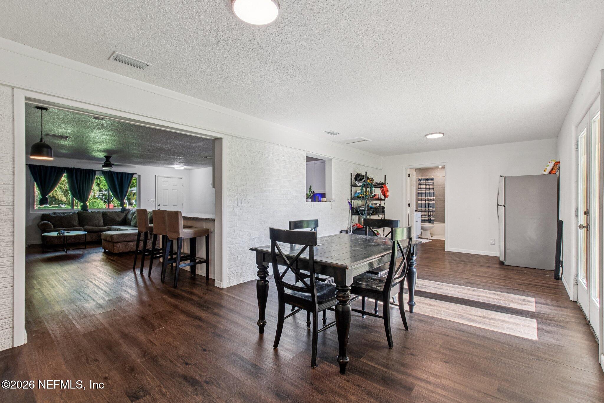 1417 Clock Street Jacksonville, FL 32211 - Photo 8 of 39 a view of a dining room with furniture and wooden floor
