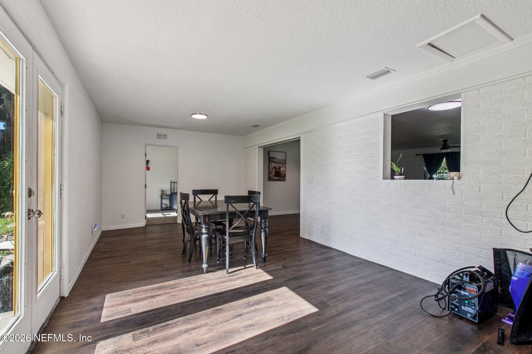 1417 Clock Street Jacksonville, FL 32211 - Photo 9 of 39 a view of a dining room with furniture and wooden floor