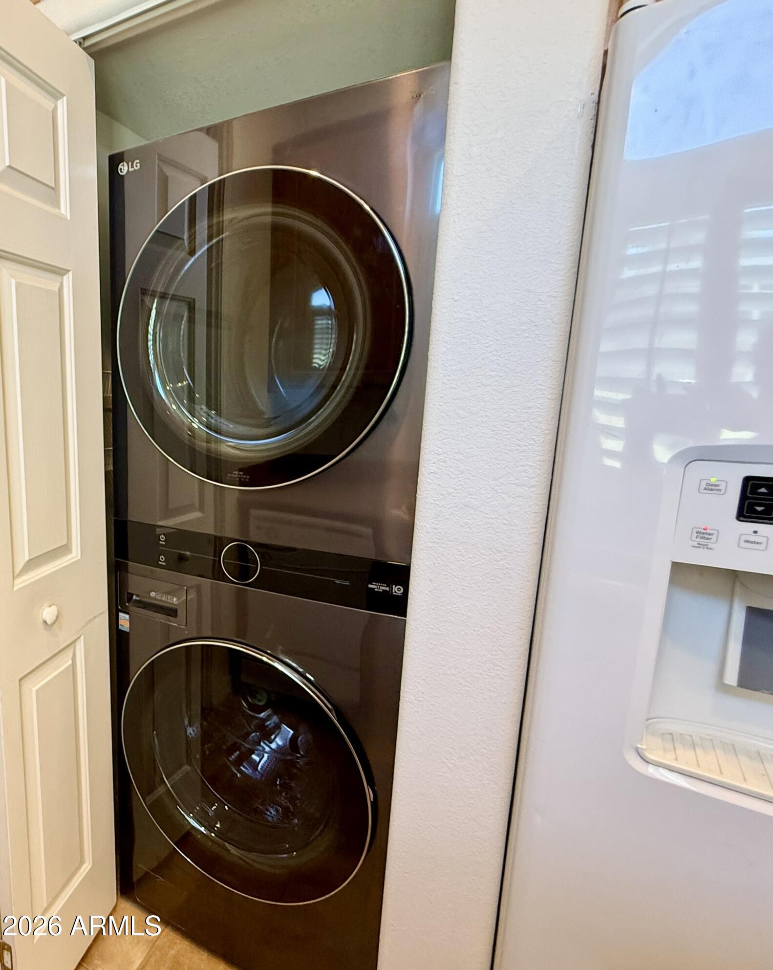 201 South Greenfield Road, Unit 58 Mesa, AZ 85206 - Photo 15 of 40 Stacked LG Washer and Dryer in Kitchen