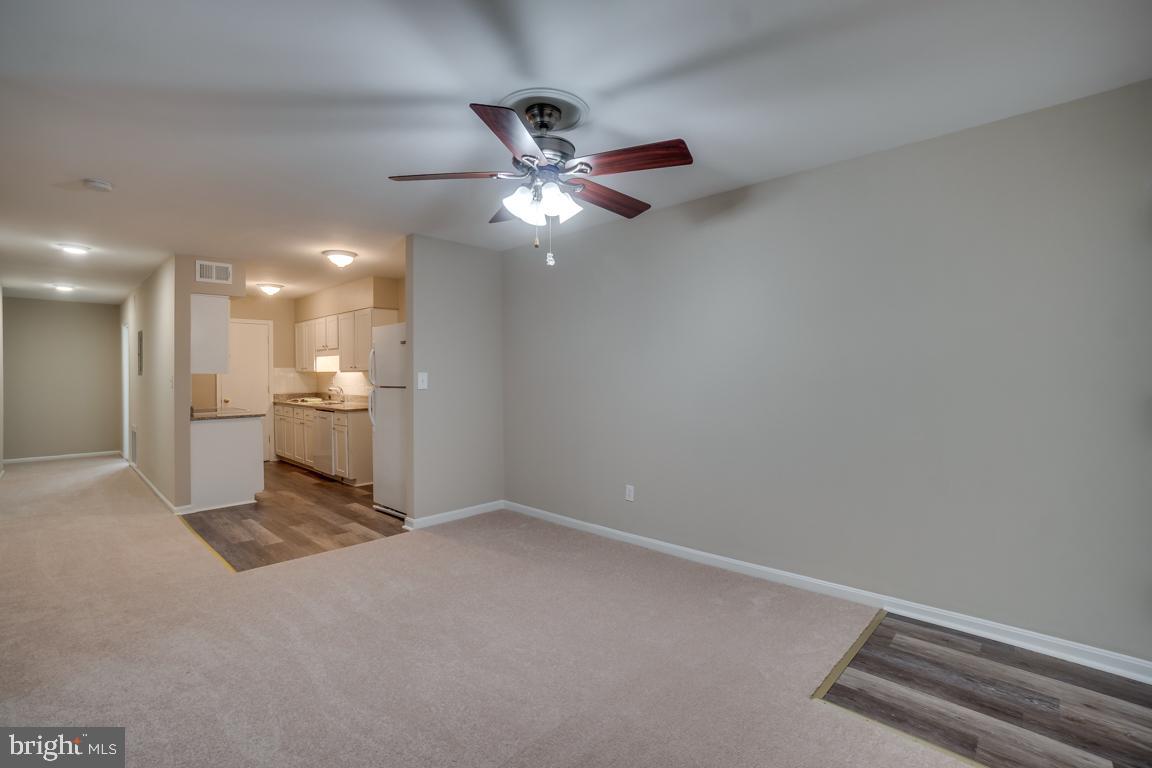 5811 Cambridge Drive, Unit 674 Springfield, VA 22152 - Photo 12 of 37 a view of a livingroom with a ceiling fan and window