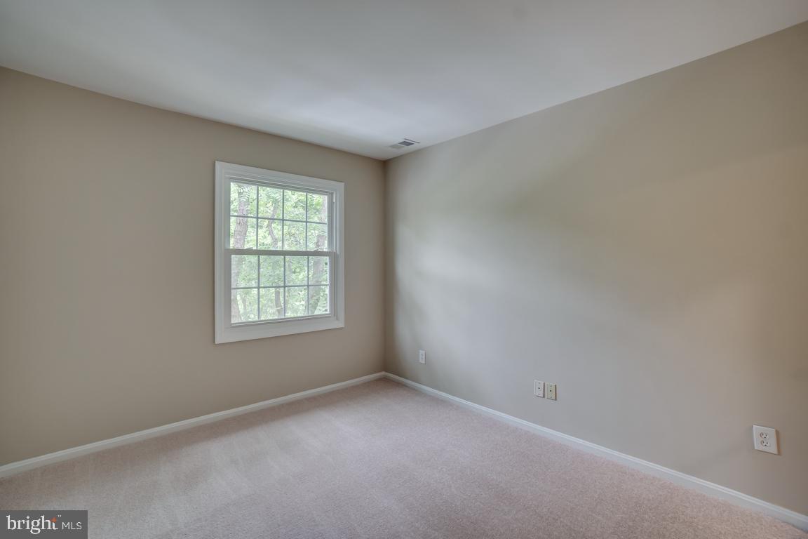 5811 Cambridge Drive, Unit 674 Springfield, VA 22152 - Photo 18 of 37 an empty room with a window