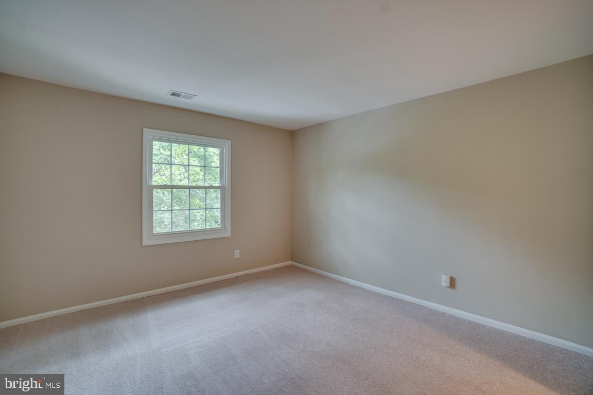 5811 Cambridge Drive, Unit 674 Springfield, VA 22152 - Photo 22 of 37 an empty room with a window