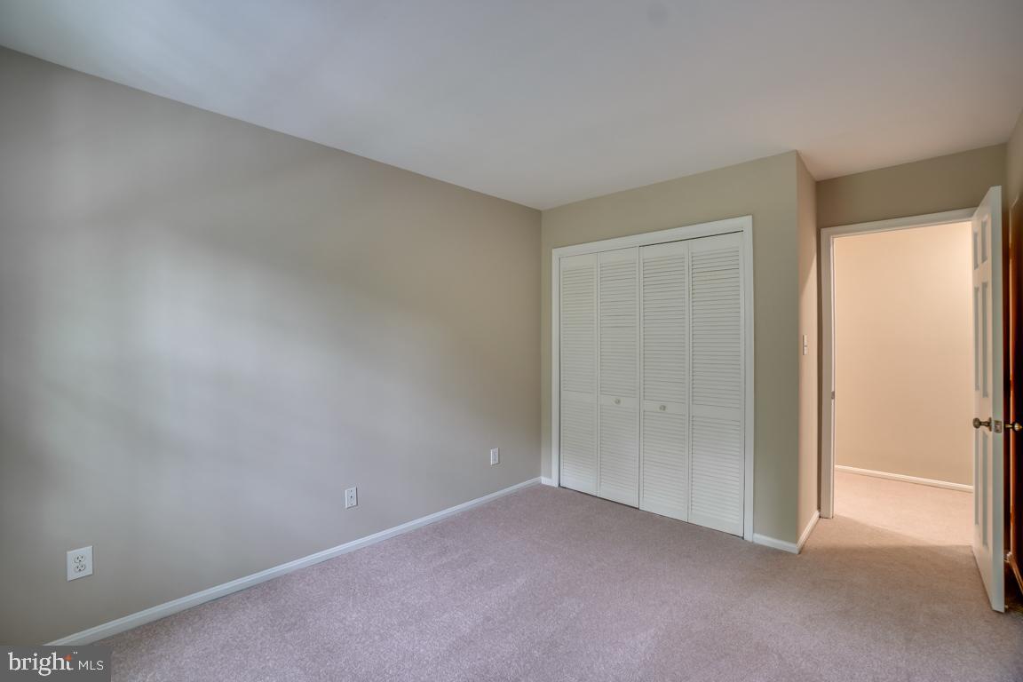 5811 Cambridge Drive, Unit 674 Springfield, VA 22152 - Photo 23 of 37 a view of an empty room and closet area