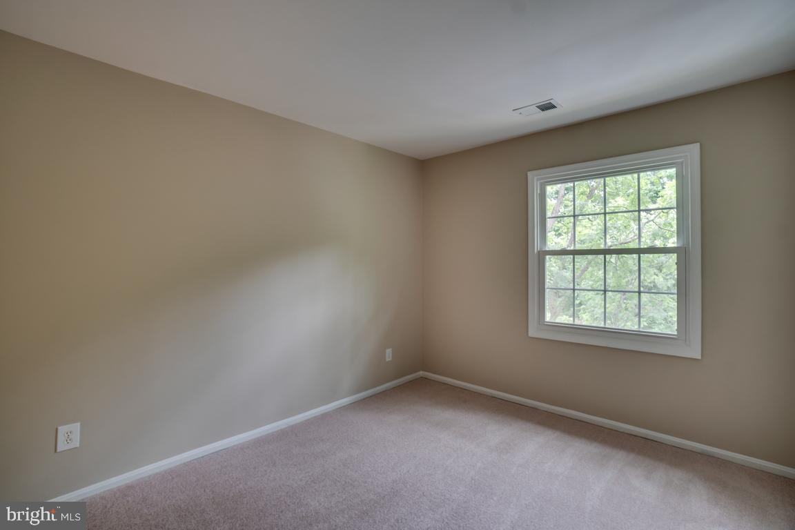 5811 Cambridge Drive, Unit 674 Springfield, VA 22152 - Photo 25 of 37 an empty room with a window