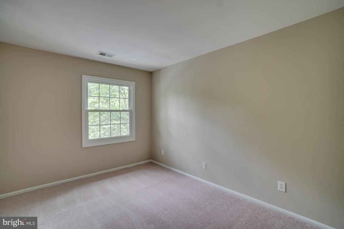 5811 Cambridge Drive, Unit 674 Springfield, VA 22152 - Photo 26 of 37 an empty room with a window