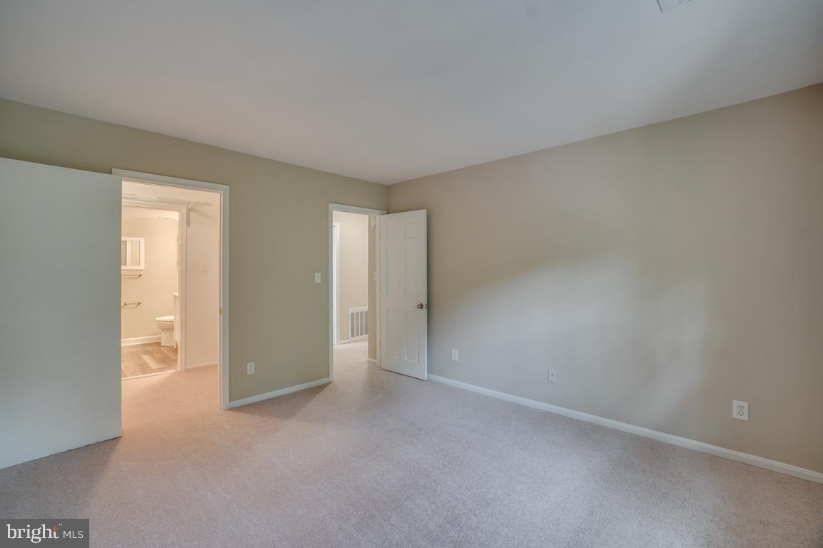 5811 Cambridge Drive, Unit 674 Springfield, VA 22152 - Photo 28 of 37 a view of an empty room and closet area