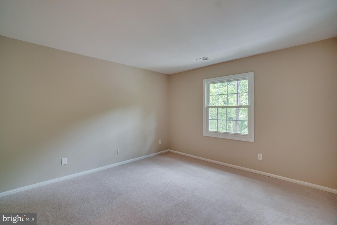 5811 Cambridge Drive, Unit 674 Springfield, VA 22152 - Photo 29 of 37 an empty room with a window