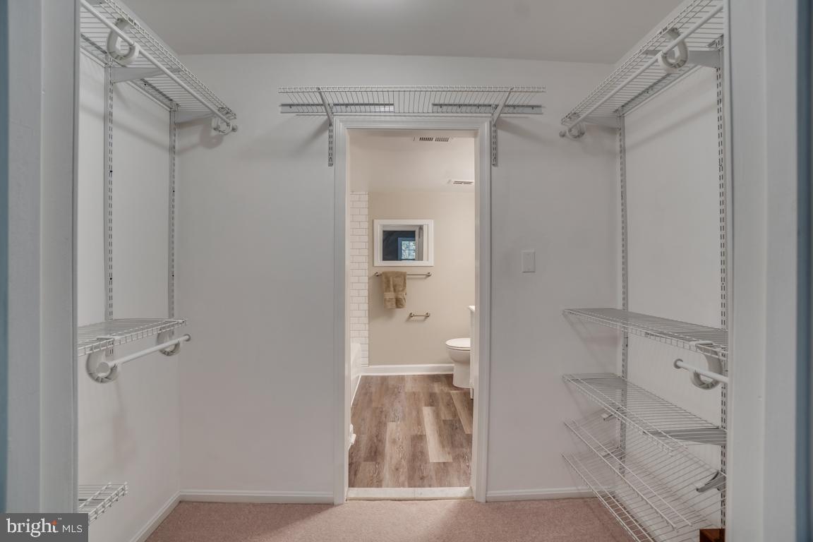 5811 Cambridge Drive, Unit 674 Springfield, VA 22152 - Photo 30 of 37 a bathroom with a glass shower door
