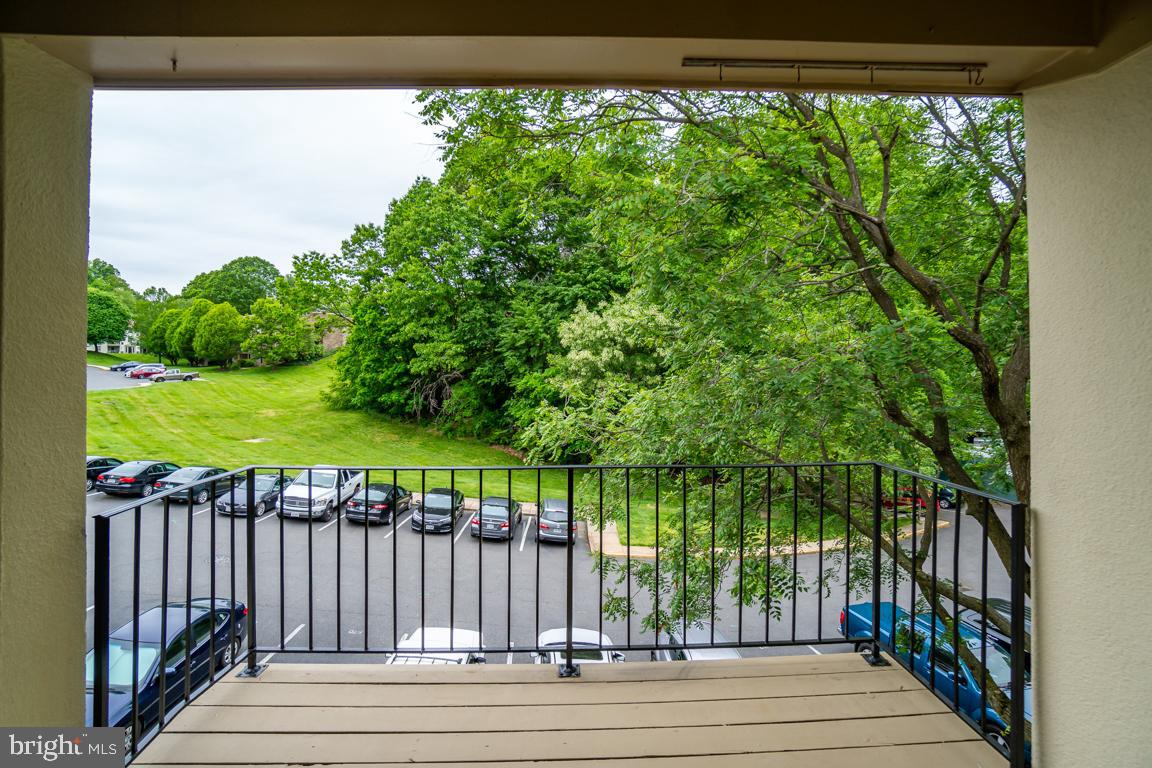 5811 Cambridge Drive, Unit 674 Springfield, VA 22152 - Photo 35 of 37 a view of a porch with a yard