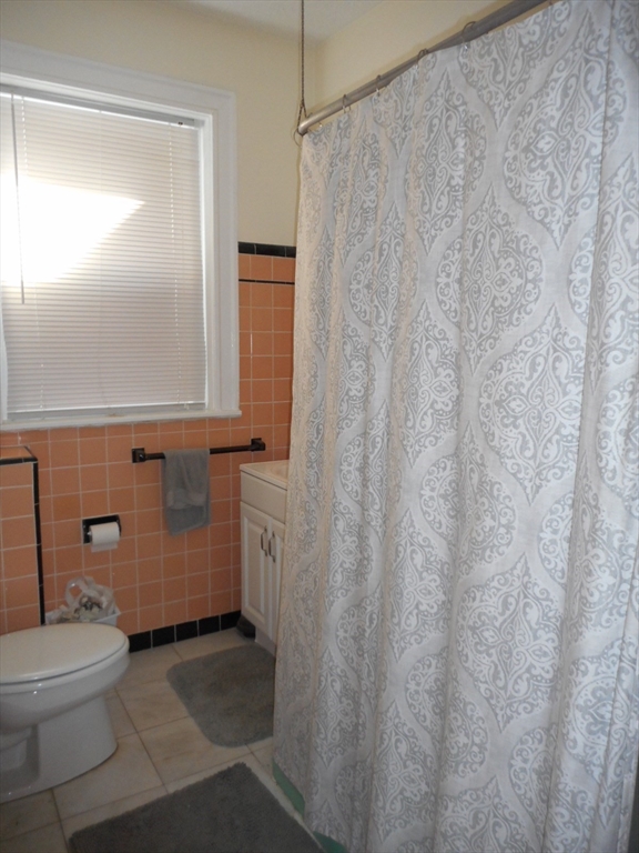 6 Beals Street, Unit 2 Brookline, MA 02446 - Photo 3 of 9 a bathroom with a toilet and a shower