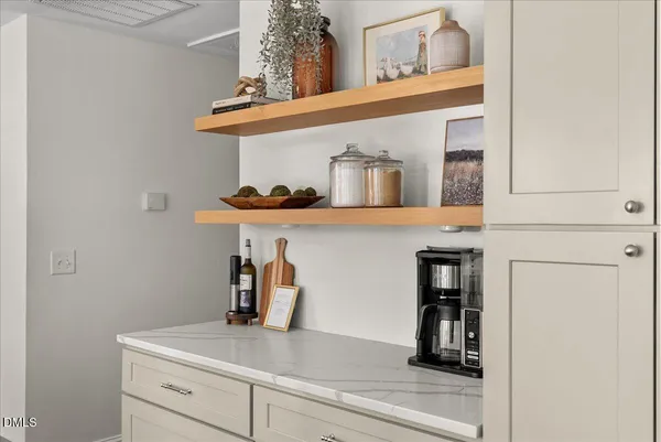 a view of storage and utility room with closet