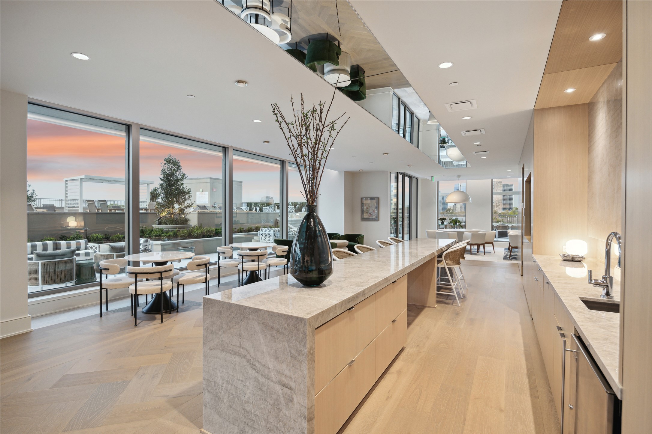 5656 San Felipe Street, Unit 701 Houston, TX 77056 - Photo 26 of 44 This spacious lounge is designed for effortless entertaining. Equipped with premium center island, coffee bar, a discrete catering kitchen perfect for hosting private gatherings.