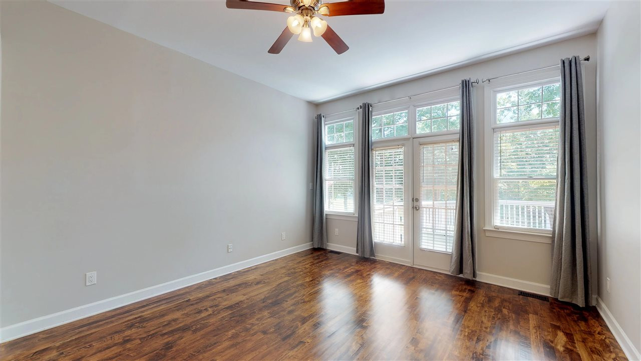 10101 Goodview Court Raleigh, NC 27613 - Photo 16 of 30 1st-floor Master BR w/wood floors opens to deck